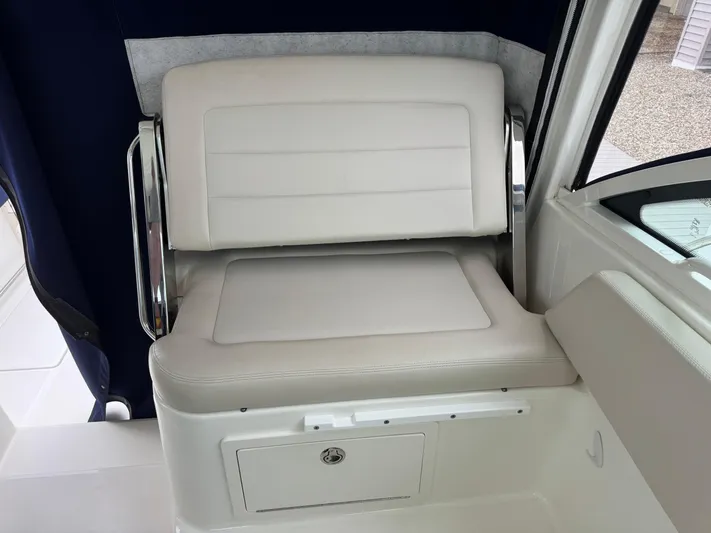  Yacht Photos Pics 2019 Boston Whaler 315 Conquest interior seat with storage compartment.