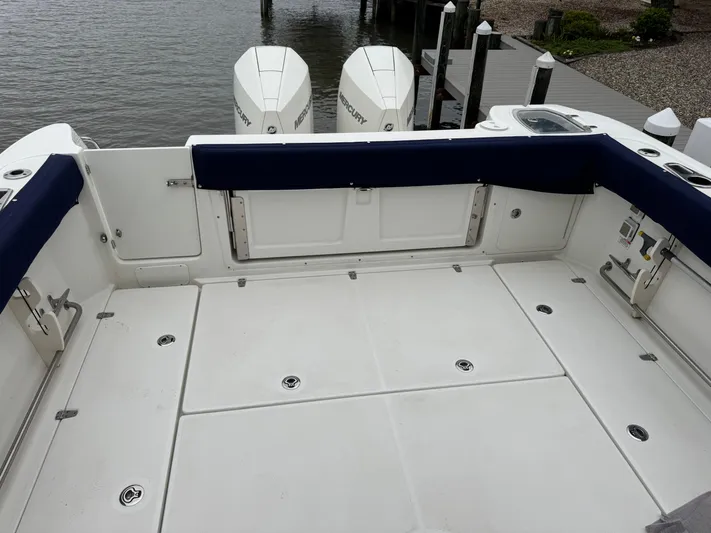  Yacht Photos Pics 2019 Boston Whaler 315 Conquest boat deck with twin outboard engines.