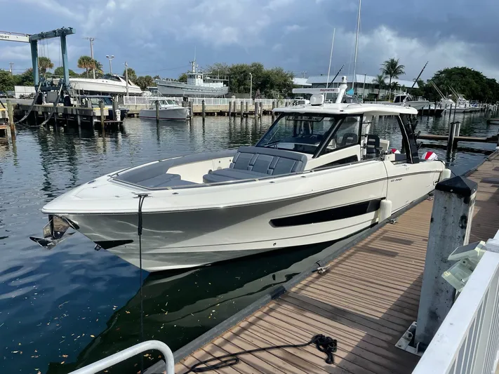 Bft Yacht Photos Pics 2021 Boston Whaler 420OR boat docked at marina, showcasing sleek design and modern features.