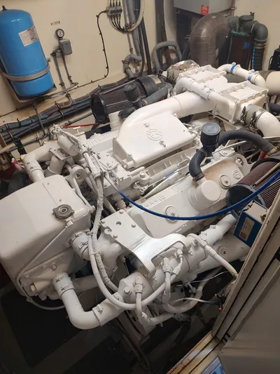 Family Board Meeting Yacht Photos Pics Engine room of a 1987 Hatteras 54MY with white engine.