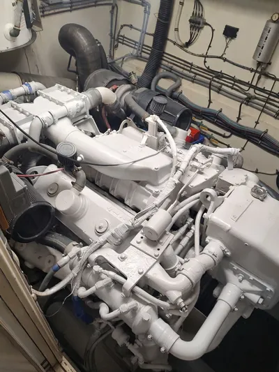 Family Board Meeting Yacht Photos Pics Engine room of a 1987 Hatteras 54MY with white engine.