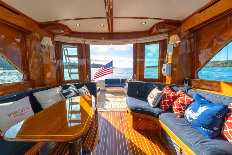 Virginia Yacht Photos Pics Luxurious interior of 2013 Hinckley Talaria 48 Flybridge yacht with elegant wood finish and plush seating.
