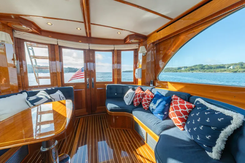 Virginia Yacht Photos Pics Luxurious interior of 2013 Hinckley Talaria 48 Flybridge yacht with elegant wood finish and ocean view.