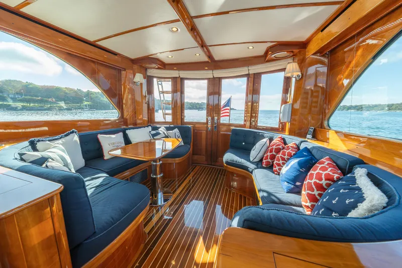 Virginia Yacht Photos Pics Luxurious 2013 Hinckley Talaria 48 Flybridge interior with elegant wood finish and plush seating.