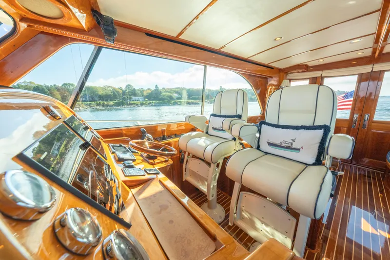 Virginia Yacht Photos Pics Luxurious 2013 Hinckley Talaria 48 Flybridge interior with elegant helm and plush seating.