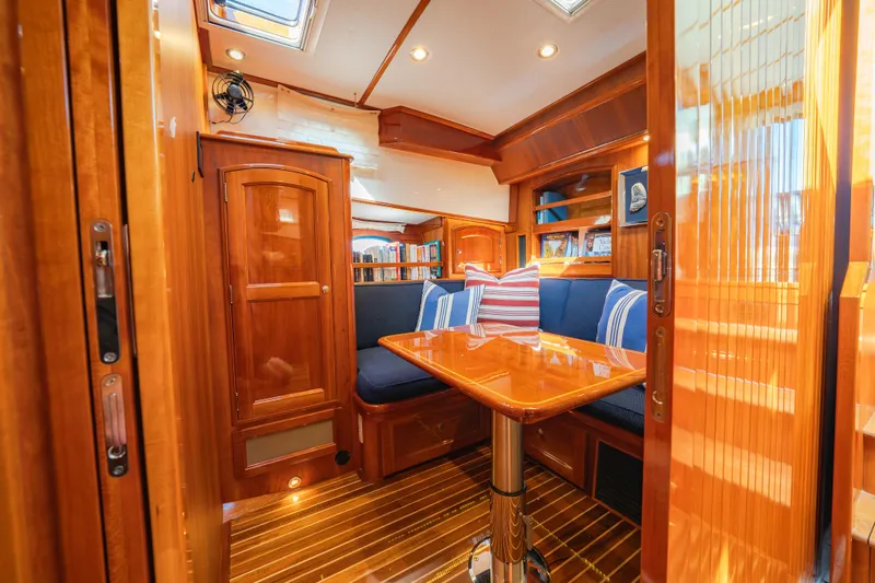 Virginia Yacht Photos Pics Luxurious interior of 2013 Hinckley Talaria 48 Flybridge with polished wood and cozy seating.