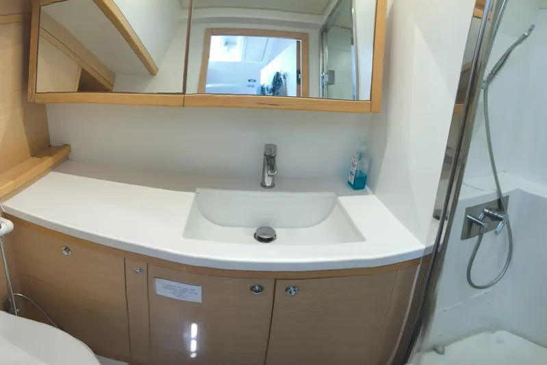 Sami Malu Yacht Photos Pics Modern bathroom interior on 2017 Lagoon 52 F yacht, featuring sink and shower.