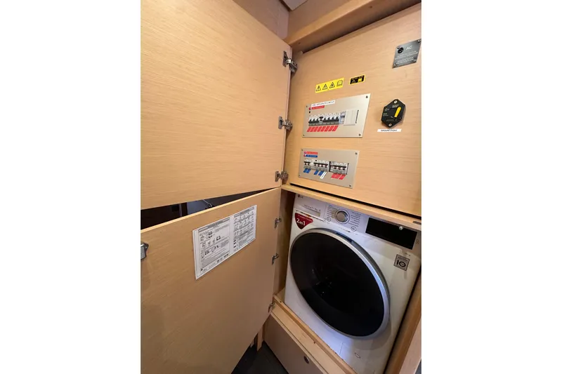 Sami Malu Yacht Photos Pics Laundry area with control panels in 2017 Lagoon 52 F yacht.