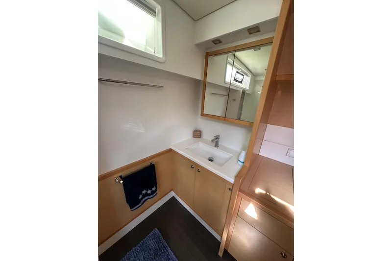 Sami Malu Yacht Photos Pics Modern bathroom interior of 2017 Lagoon 52 F yacht with sink and mirror.
