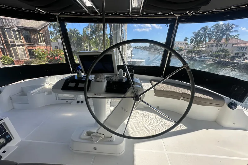 Sami Malu Yacht Photos Pics Helm of 2017 Lagoon 52 F catamaran with panoramic marina view.