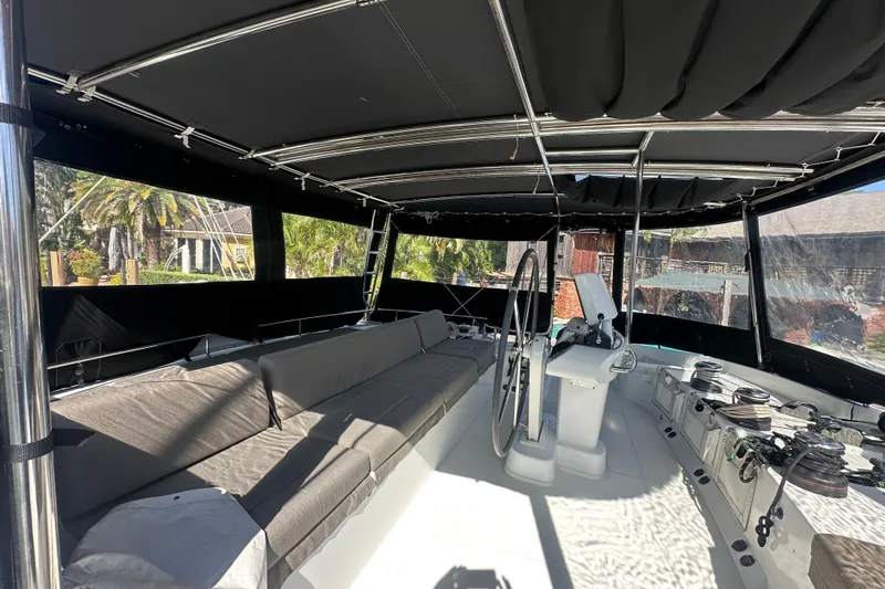 Sami Malu Yacht Photos Pics Spacious cockpit of 2017 Lagoon 52 F catamaran with seating and helm station.