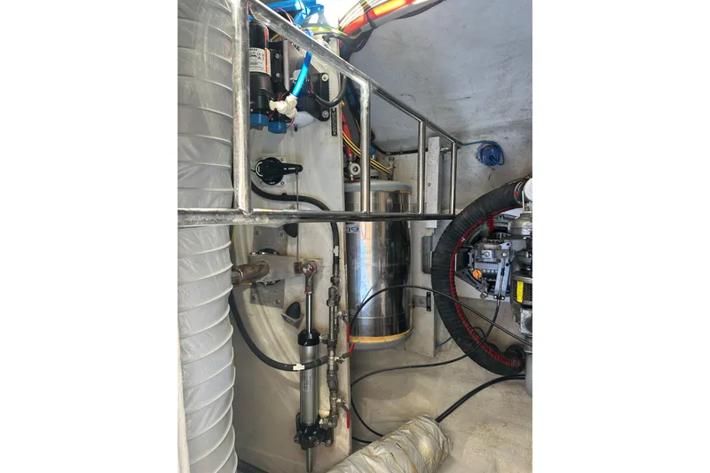 Sami Malu Yacht Photos Pics Engine compartment of a 2017 Lagoon 52 F yacht, showcasing mechanical components and wiring.