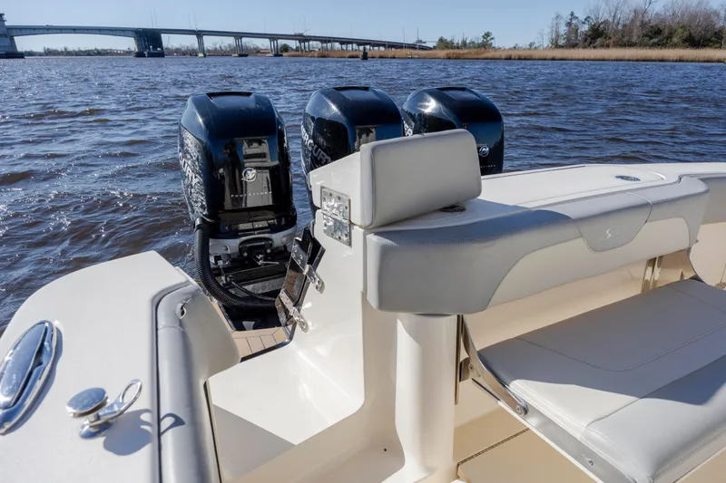  Yacht Photos Pics 2019 Scout 355 LXF boat with triple Mercury engines on a sunny day.