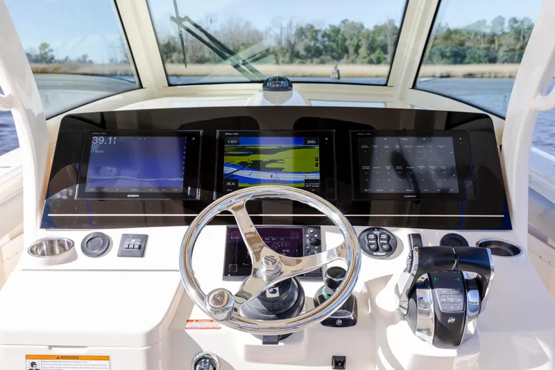  Yacht Photos Pics 2019 Scout 355 LXF boat dashboard with advanced navigation displays and controls.