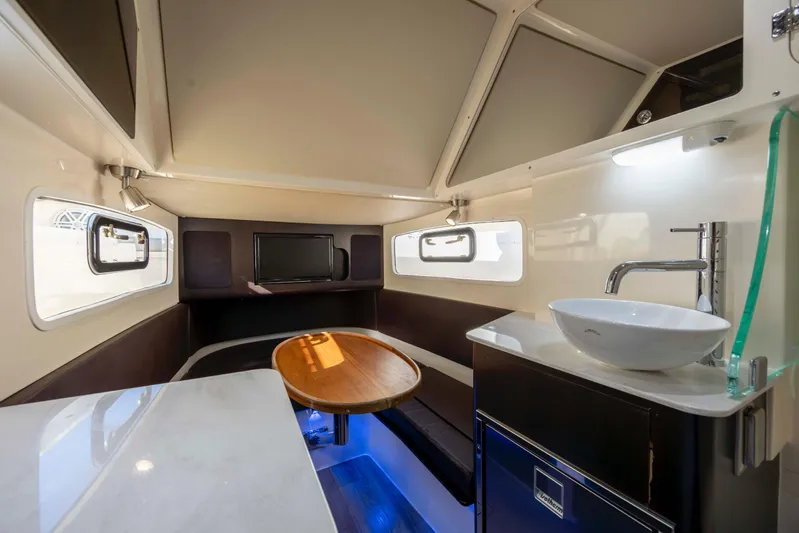  Yacht Photos Pics Luxurious interior of 2019 Scout 355 LXF boat with modern amenities and elegant design.