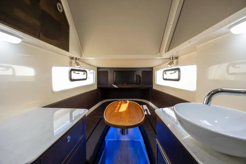  Yacht Photos Pics Luxurious interior of 2019 Scout 355 LXF boat with modern amenities and elegant design.