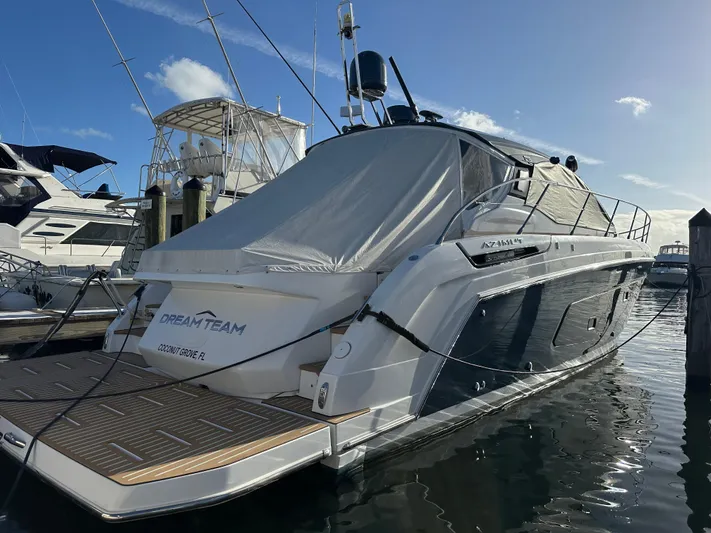  Yacht Photos Pics Azimut Atlantis 45 yacht, 2021 model, docked at marina under clear blue sky.