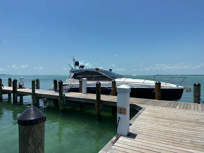  Yacht Photos Pics 2021 Azimut Atlantis 45 yacht docked at a sunny marina.