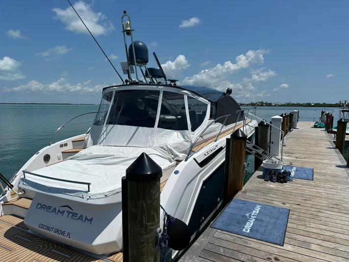  Yacht Photos Pics 2021 Azimut Atlantis 45 yacht docked at a sunny marina.