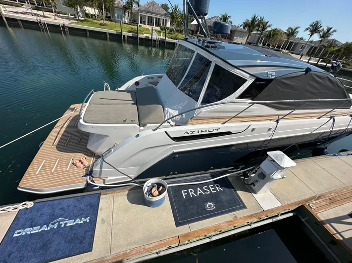  Yacht Photos Pics Azimut Atlantis 45 yacht docked at marina, 2021 model, with "Dream Team" and "Fraser" mats.