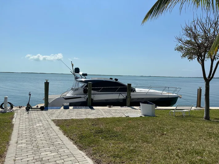  Yacht Photos Pics Azimut Atlantis 45 yacht docked by the water, 2021 model, sunny day.