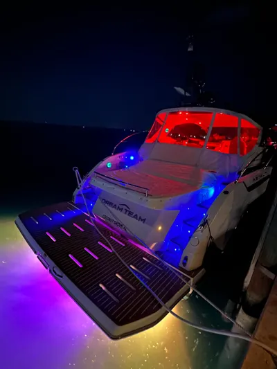  Yacht Photos Pics Azimut Atlantis 45 yacht, 2021 model, illuminated with colorful lights at night.