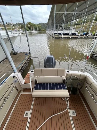  Yacht Photos Pics 2023 Ranger Tugs R23 boat with wooden deck, docked at a marina.
