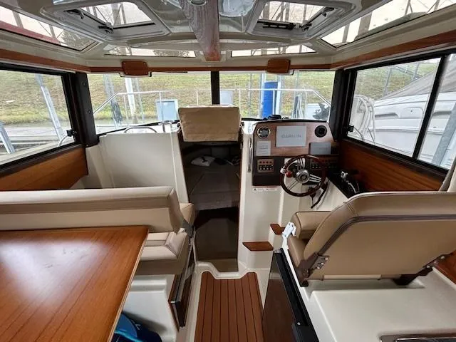  Yacht Photos Pics Interior of 2023 Ranger Tugs R23 boat with modern helm and seating area.
