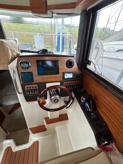  Yacht Photos Pics 2023 Ranger Tugs R23 boat interior with modern dashboard and steering wheel.