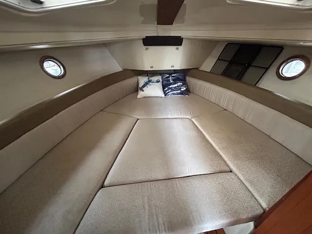  Yacht Photos Pics 2023 Ranger Tugs R23 cabin interior with cozy bed and decorative pillows.