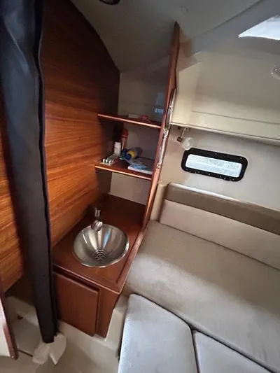  Yacht Photos Pics 2023 Ranger Tugs R23 cabin interior with sink and seating area.