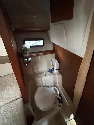  Yacht Photos Pics 2023 Ranger Tugs R23 boat interior with compact bathroom and window.