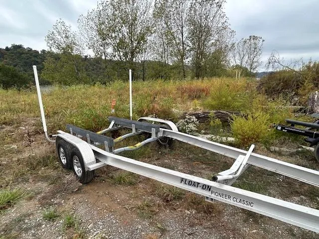  Yacht Photos Pics Trailer for 2023 Ranger Tugs R23, parked in a grassy area.