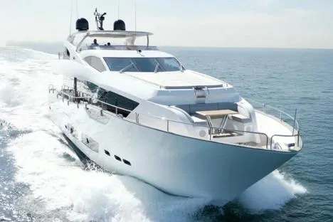  Yacht Photos Pics 2018 Sunseeker 95 Yacht cruising on open water, showcasing luxury and sleek design.