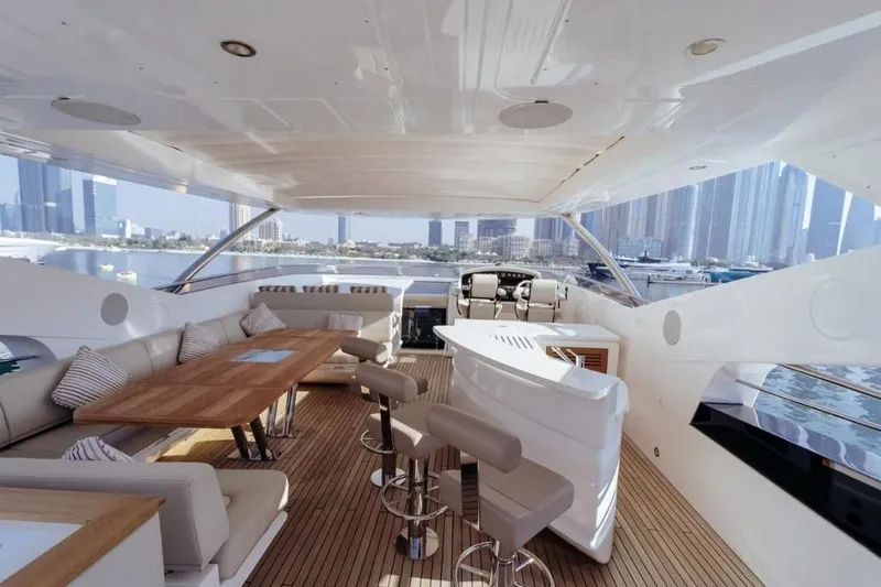  Yacht Photos Pics Luxurious 2018 Sunseeker 95 Yacht interior with elegant seating and city skyline view.