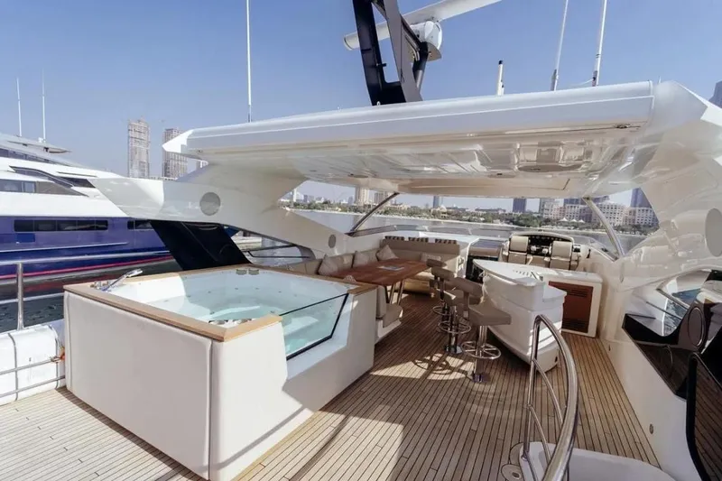  Yacht Photos Pics Luxurious 2018 Sunseeker 95 Yacht with spacious deck, jacuzzi, and modern seating area.