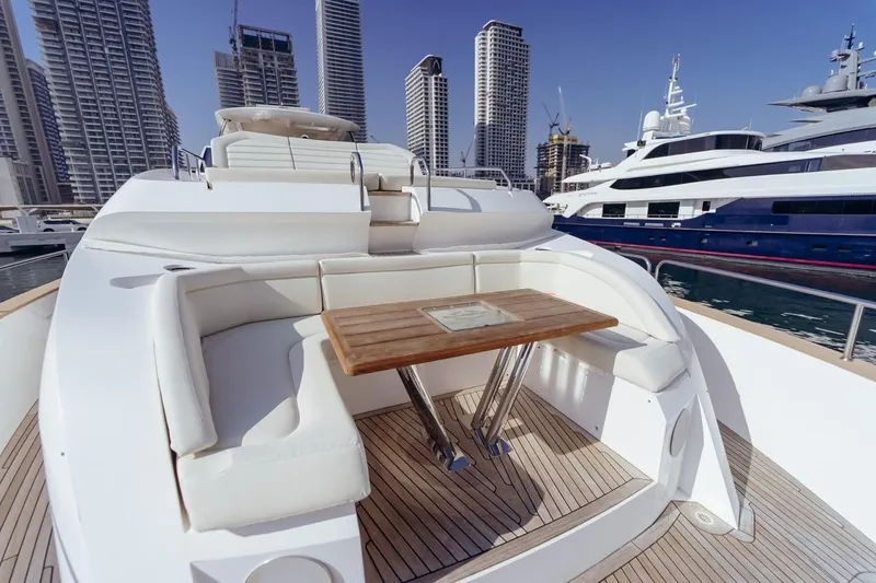  Yacht Photos Pics Luxurious 2018 Sunseeker 95 Yacht with elegant seating and table, docked in a modern marina.