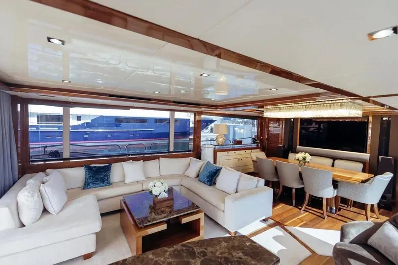  Yacht Photos Pics Luxurious interior of 2018 Sunseeker 95 Yacht with elegant seating and dining area.
