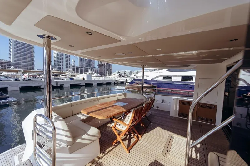  Yacht Photos Pics Luxurious 2018 Sunseeker 95 Yacht deck with elegant seating and marina view.