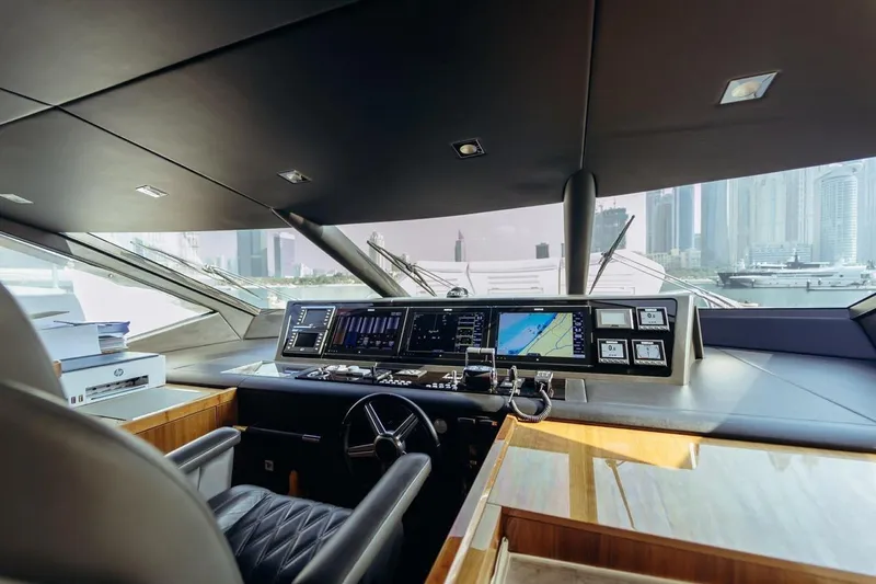  Yacht Photos Pics Interior view of 2018 Sunseeker 95 Yacht cockpit with modern navigation controls.