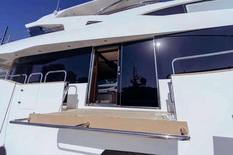  Yacht Photos Pics 2018 Sunseeker 95 Yacht exterior with sleek design and modern glass doors.