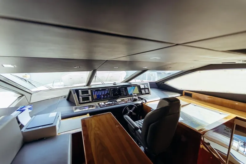  Yacht Photos Pics 2018 Sunseeker 95 Yacht helm with modern navigation equipment and luxurious interior design.
