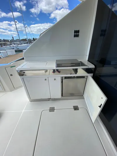 Inconseavable Yacht Photos Pics 2014 Marquis 500 Sport Bridge yacht with outdoor kitchen.