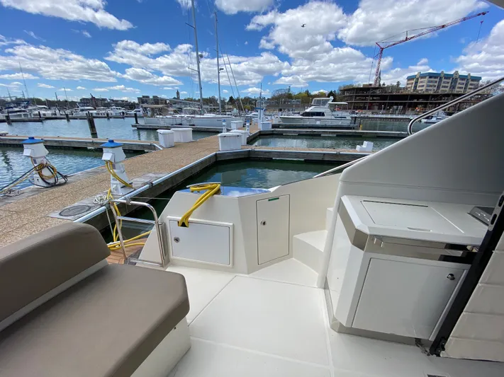 Inconseavable Yacht Photos Pics Marquis 500 Sport Bridge 2014 at dock with sunny sky.