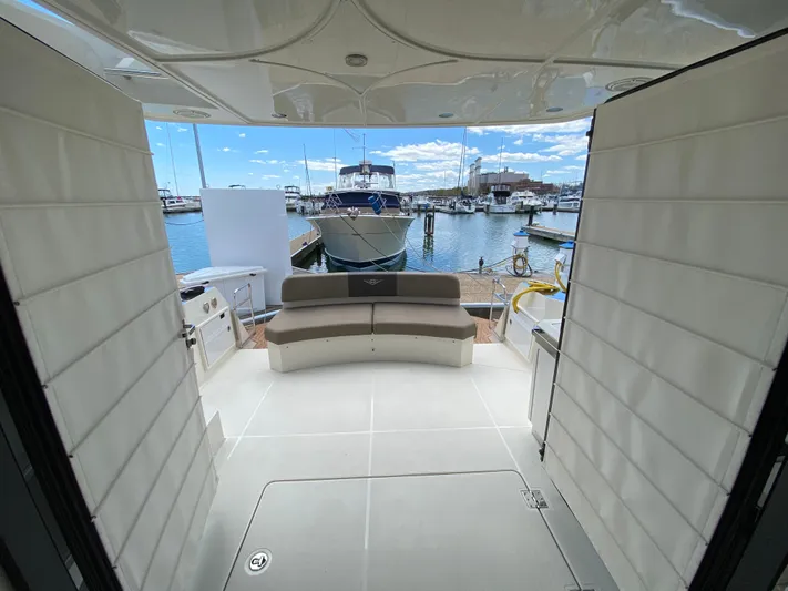 Inconseavable Yacht Photos Pics Interior view of 2014 Marquis 500 Sport Bridge yacht at marina.