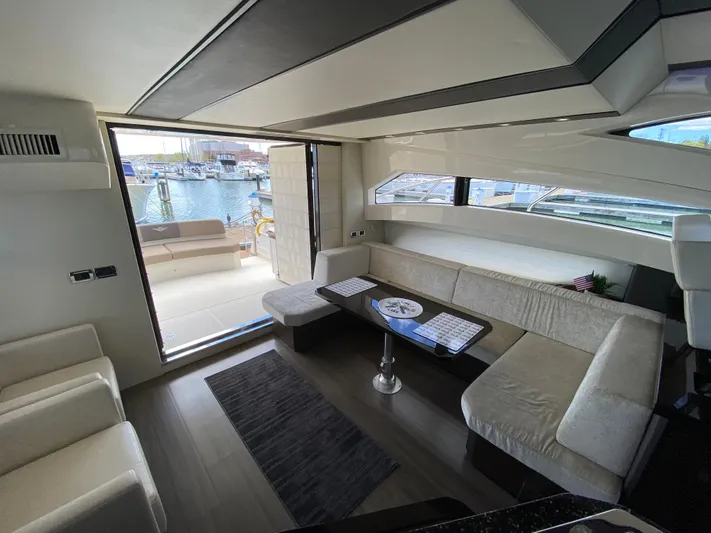 Inconseavable Yacht Photos Pics Interior of 2014 Marquis 500 Sport Bridge yacht with harbor view.