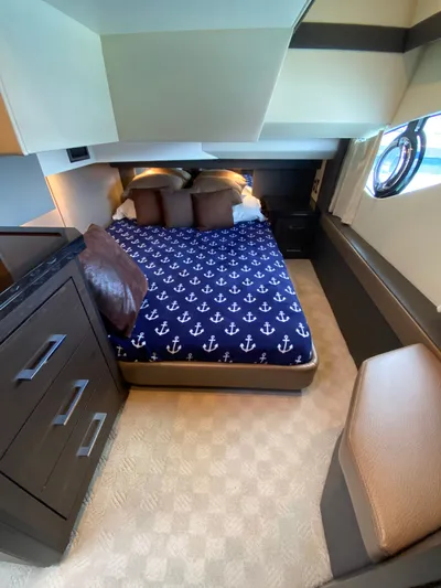 Inconseavable Yacht Photos Pics Interior of 2014 Marquis 500 Sport Bridge with anchor-themed bedding.