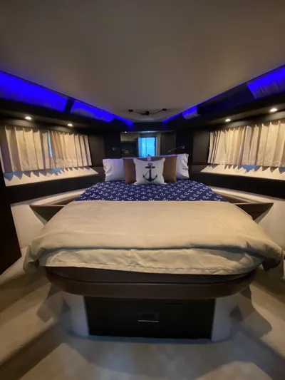 Inconseavable Yacht Photos Pics Luxurious bedroom on a 2014 Marquis 500 Sport Bridge yacht.