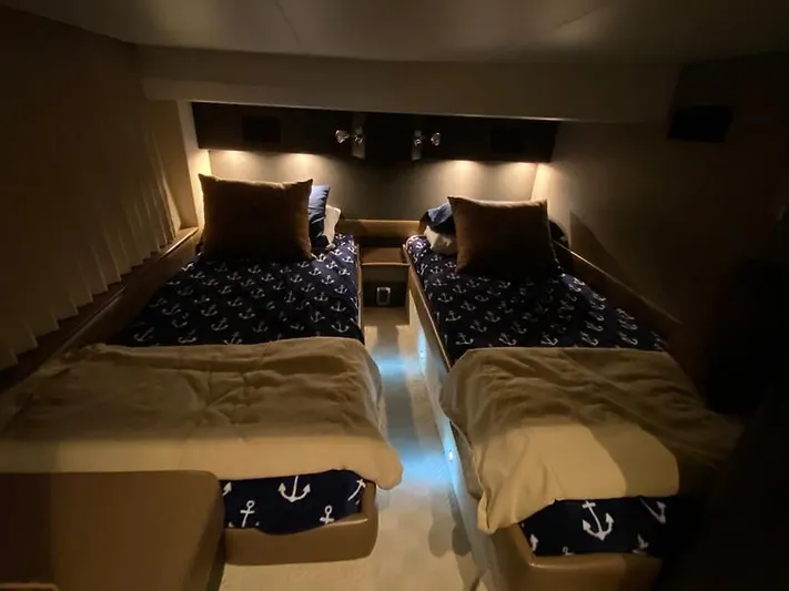 Inconseavable Yacht Photos Pics Interior of 2014 Marquis 500 Sport Bridge with twin beds.