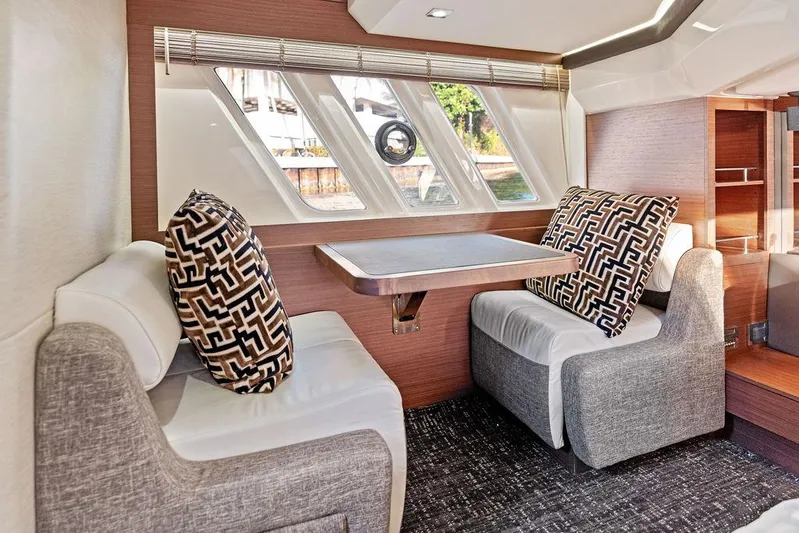  Yacht Photos Pics Luxurious interior of 2015 Sea Ray 510 Fly yacht with elegant seating and stylish decor.